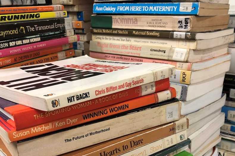 Stacks of old books on equality issues