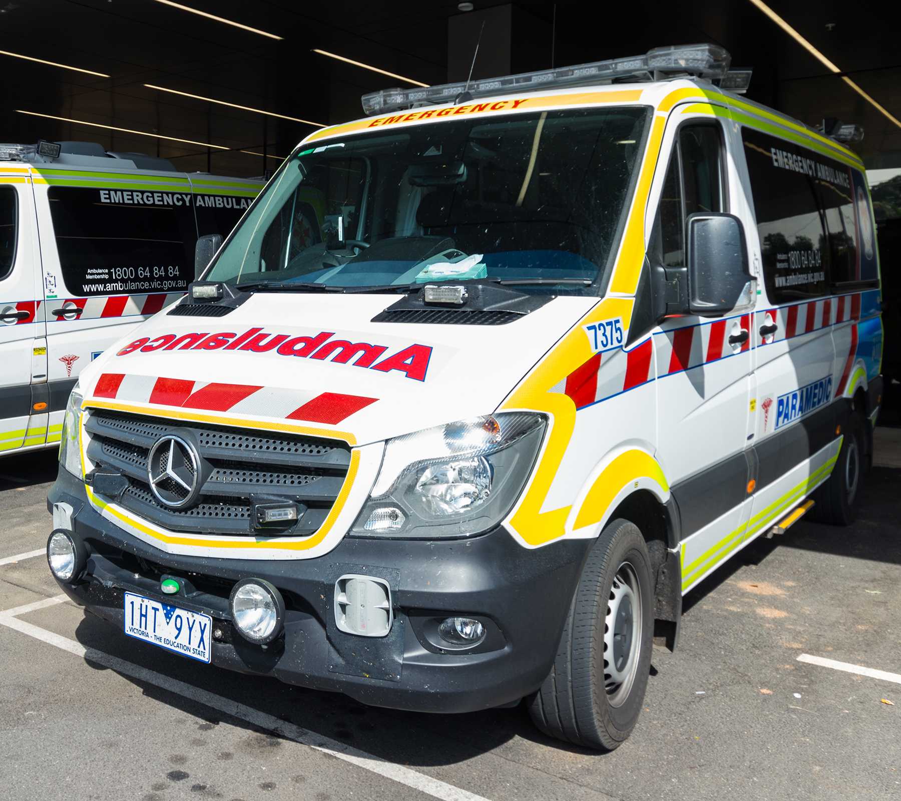 Bendigo, Australia - October 28, 2018: Ambulance Victoria Mercedes Sprinter vans outside the emergency department at the Bendigo Hospital.